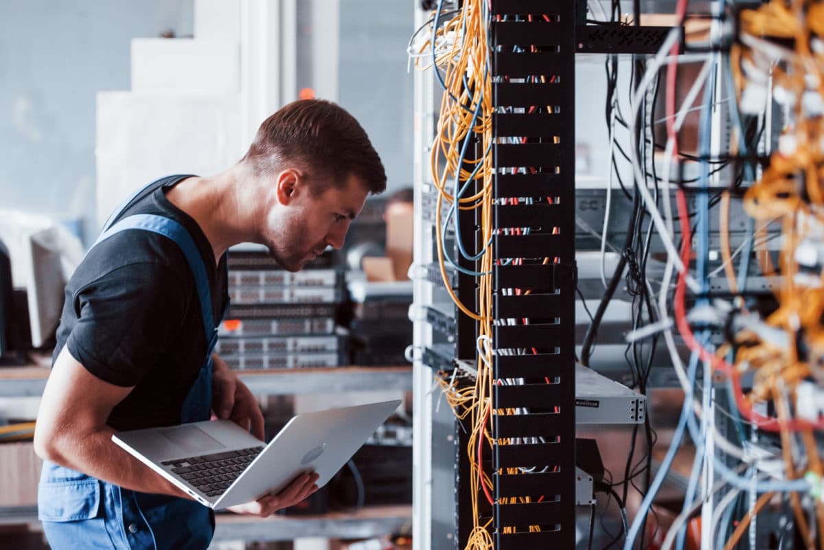 man networking in server room web